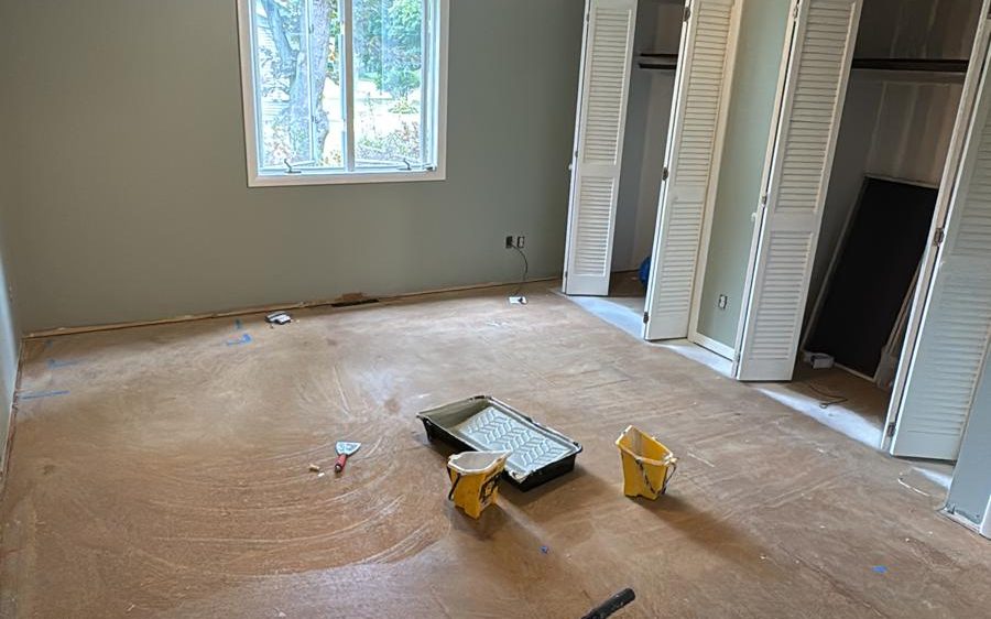 Bedroom walls painted sage green during renovation