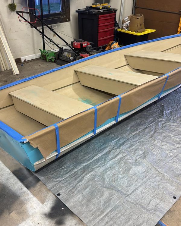Aluminum boat masked and primed before its final coat