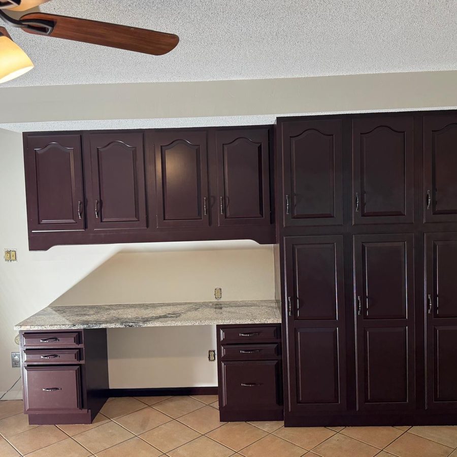 Kitchen desk and tall cabinets after painting in a deep espresso finish