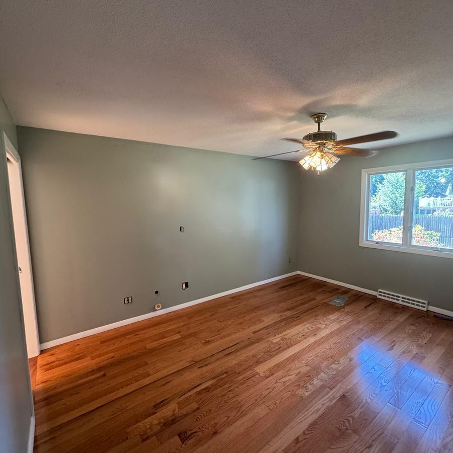 Bright bedroom with freshly painted walls and white trim