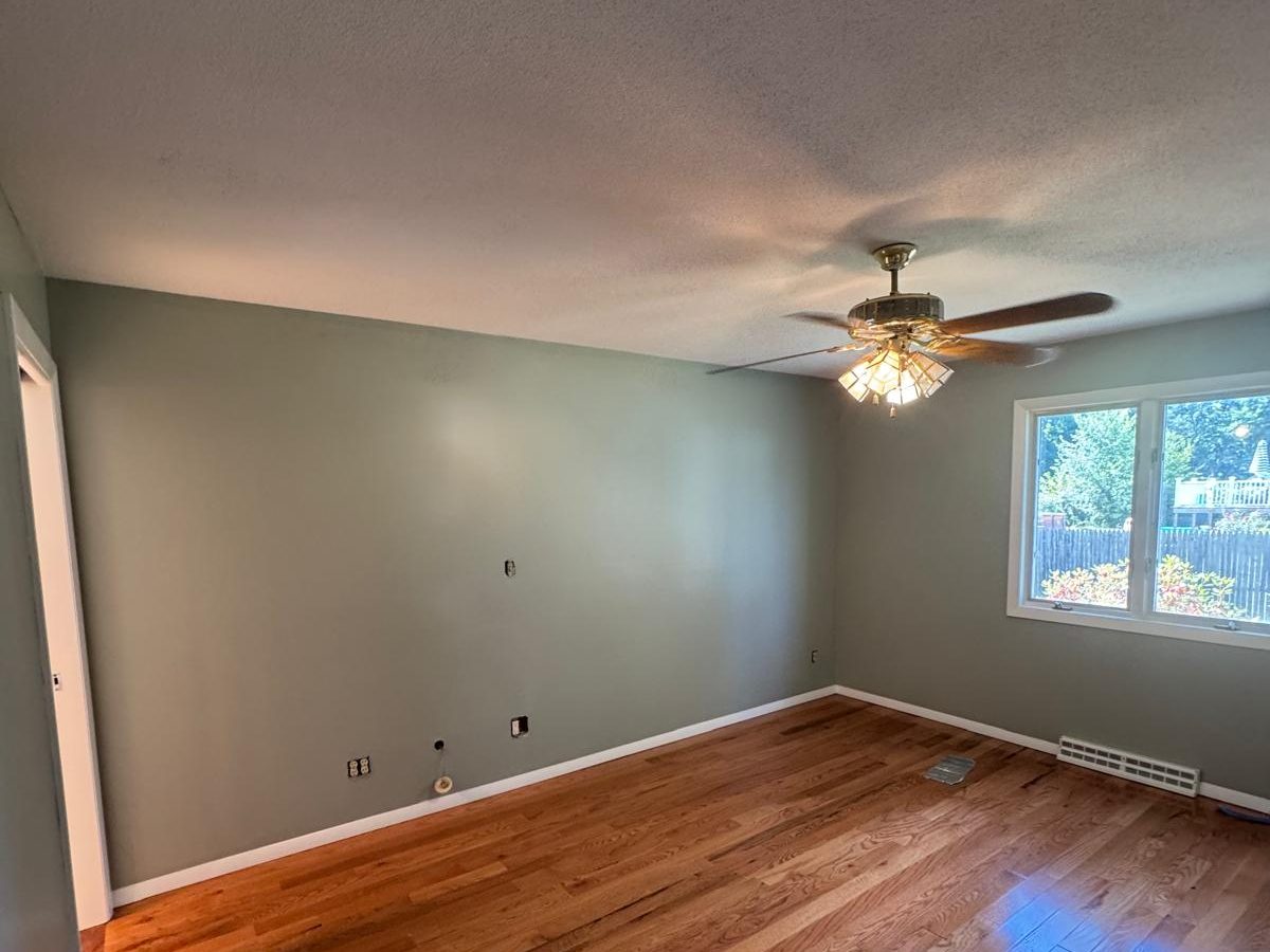 Bright bedroom with freshly painted walls and white trim
